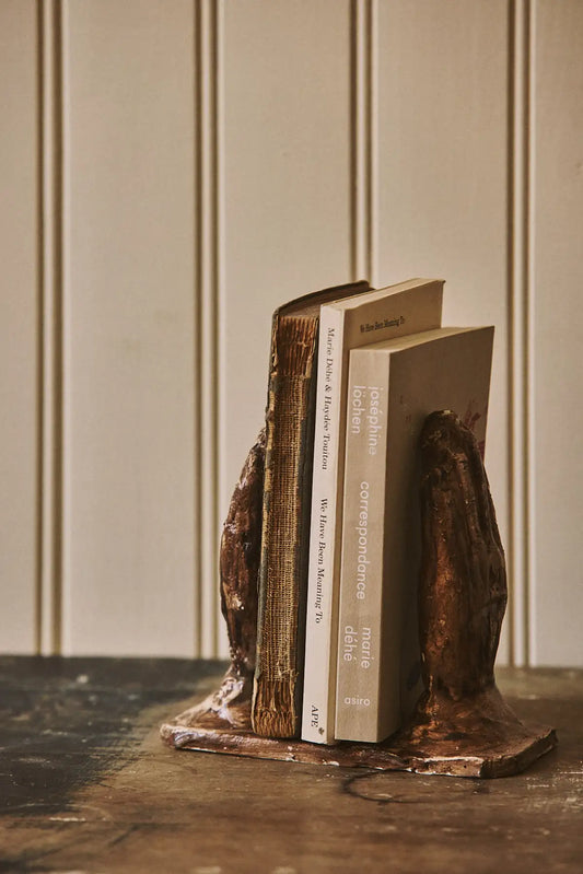 Serre-livres mains